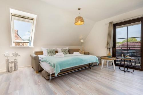 Postel nebo postele na pokoji v ubytování Haus am Strand Ferienwohnung Haus am Strand 5