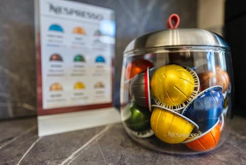 a glass jar filled with different types of food at Elegant 5 Bed House - Sleeps 9, Central Solihull, NEC, JLR, HS2, Resorts World, Airport Business and Leisure Stays, in Solihull