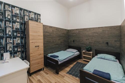 Letto o letti in una camera di Apartments and Rooms Palmers Lodge