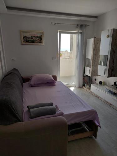 Posteľ alebo postele v izbe v ubytovaní Apartman Iva