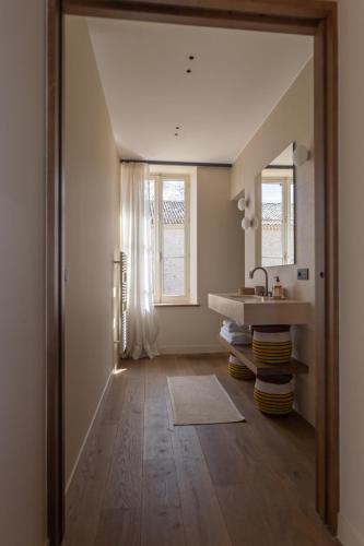 a bathroom with a sink and a mirror at Domaine de Panery in Pouzilhac