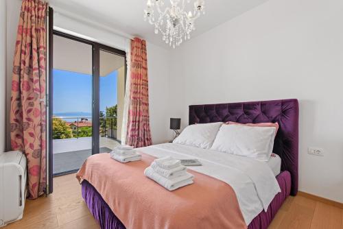 Postel nebo postele na pokoji v ubytování Apartments Villa Zara