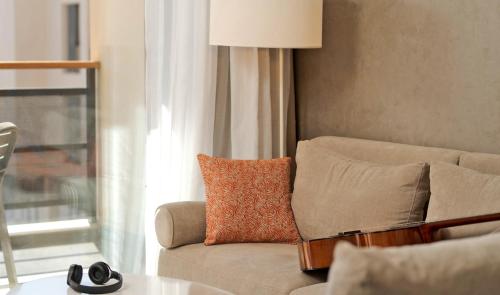 a living room with a couch and a table at Pestana CR7 Marrakech in Marrakech