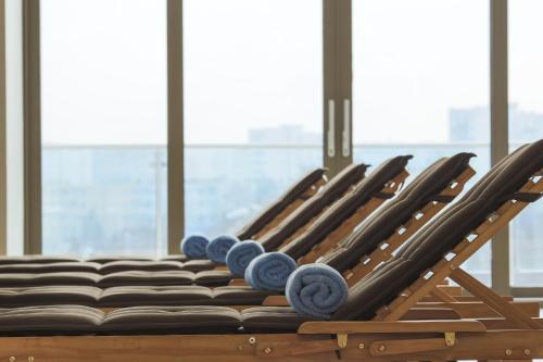 a row of chairs lined up in a row at Hotel International Iasi in Iaşi