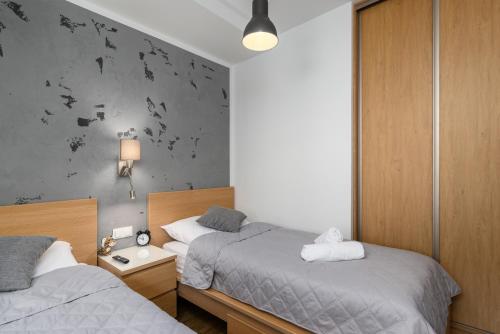 Tempat tidur dalam kamar di Czarna Perła- Apartament przy Solisku