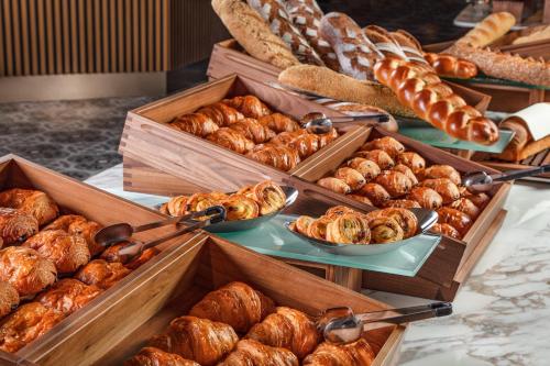 a display of different types of breads and pastries at Villars Palace in Villars-sur-Ollon