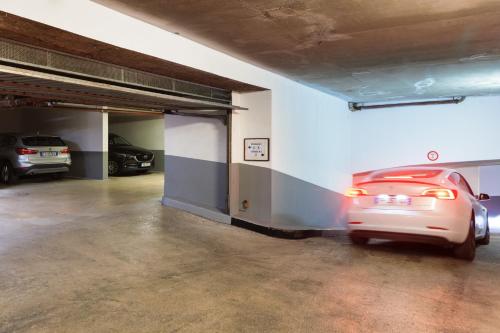 a parking garage with a car parked in it at Best Western Hotel Mediterranee Menton in Menton