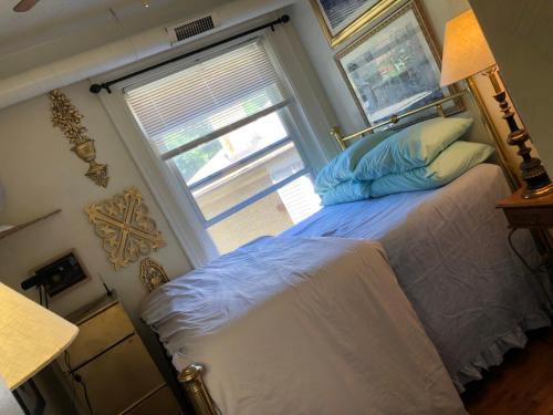 a bedroom with a bed with a large window at Highland Park Pittsburgh in Pittsburgh