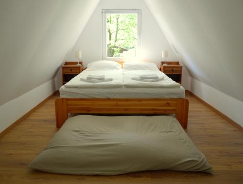Cama ou camas em um quarto em Vércse Vendégház