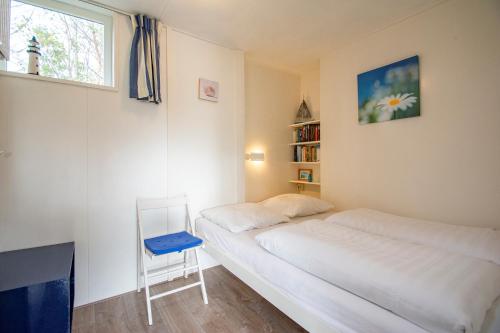 Postel nebo postele na pokoji v ubytování Garnekuul 81 Callantsoog