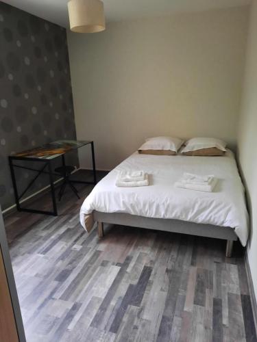 Posteľ alebo postele v izbe v ubytovaní tres bel appartement et situation au top