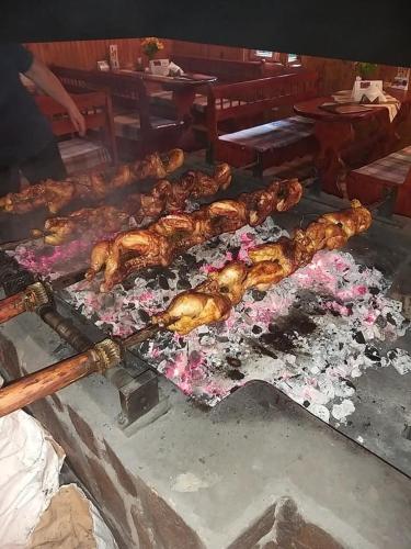 a bunch of food being cooked on a grill at Penzión Dúhový Pstruh in Bystrá