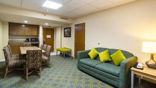 a living room with a couch and a table at Holiday Inn Express & Suites Cuernavaca by IHG in Cuernavaca