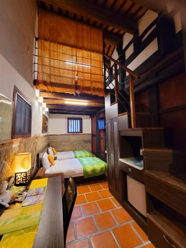 Una cama o camas en una habitación de 校長的家The Principal Home