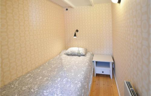 A bed or beds in a room at Nice Home In Lilla Edet With House A Panoramic View