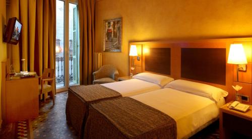 Katil atau katil-katil dalam bilik di Hotel Nouvel
