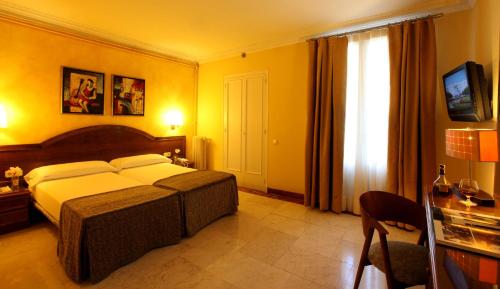 Katil atau katil-katil dalam bilik di Hotel Nouvel