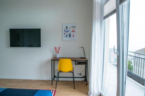 TV a/nebo společenská místnost v ubytování Occhi sul mare Apartment