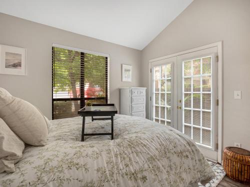 a bedroom with a bed with a table on it at Modern Cozy Townhome in Charlotte