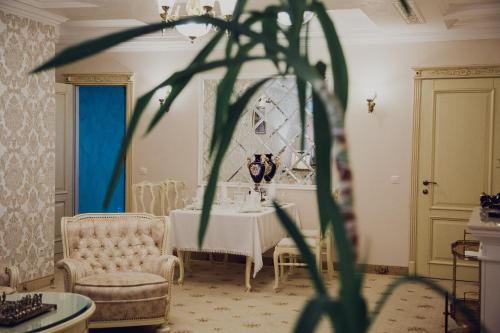 a dining room with a table and two chairs at Hotel France in Vinnytsya