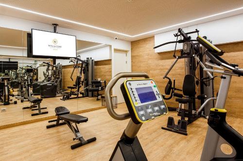 a gym with a cell phone on a treadmill at Hotel Well and Come in Barcelona