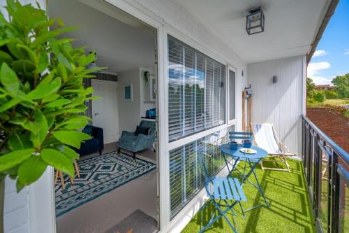 a balcony with a table and chairs on a porch at Apartment 4, Hunstanton in Hunstanton