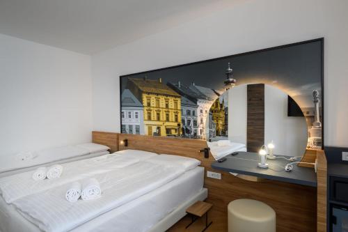 Postel nebo postele na pokoji v ubytování B&B Hotel Maribor