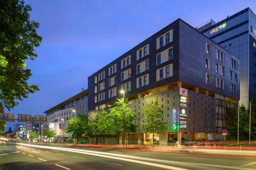a building on a city street at night at B&B Hotel Maribor in Maribor