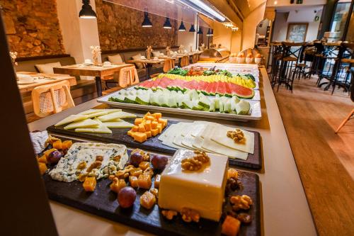 a buffet line with several different types of food at Hotel Well and Come Barcelona in Barcelona