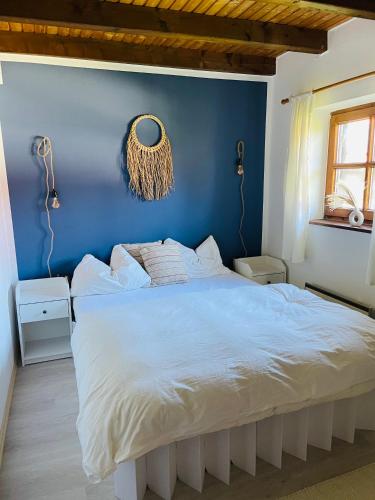 Ένα ή περισσότερα κρεβάτια σε δωμάτιο στο Ferienhaus Regeneration bayerischer Wald
