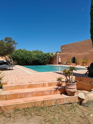 a set of stairs leading to a swimming pool at Villa Al Kharoube in Essaouira