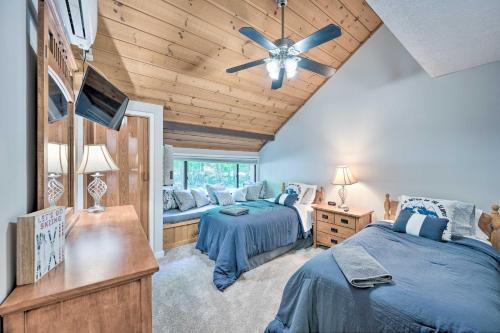 A bed or beds in a room at Village of Loon Condo in White Mtns with Pool Access