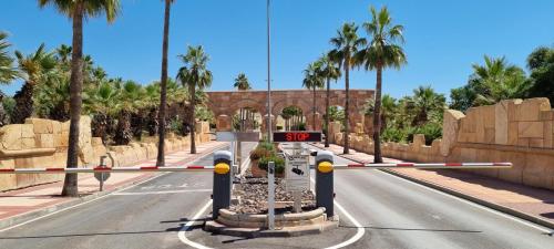 an empty road with a speed limit sign in the middle at Villa Excelente, with a private pool in Murcia