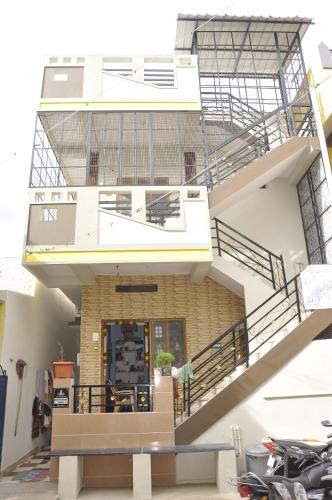 a view of a house with a staircase at Sai Ram Home Stay in Hampi