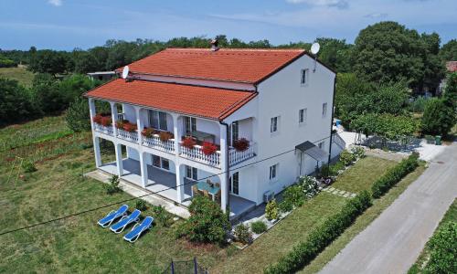 an aerial view of a house with an orange roof at Apartman Melita in Poreč