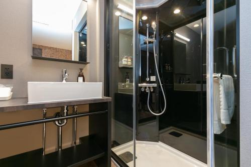 a bathroom with a shower and a sink at HOTEL TABARD TOKYO - Vacation STAY 64558v in Tokyo