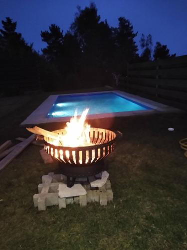 a fire pit in a yard at night at Casa en Pingueral in Tomé