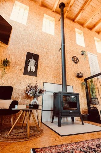 a living room with a fireplace and a stove at my_brooklyn_ DOM Z OSB in Kielce