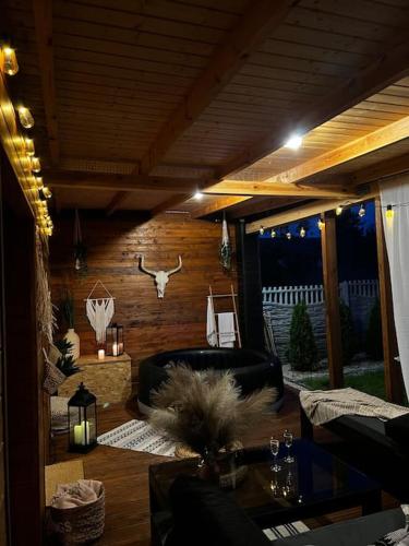 a living room with a chair and a table at my_brooklyn_ DOM Z OSB in Kielce