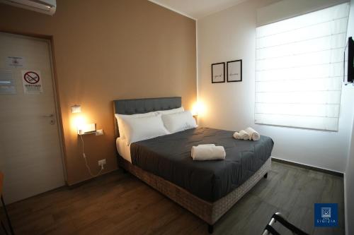 Postel nebo postele na pokoji v ubytování Casa Sigizia
