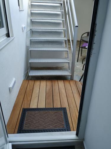 a stairwell with a set of stairs and a stair mat at demis Mykonos stay 2 in Platis Yialos Mykonos