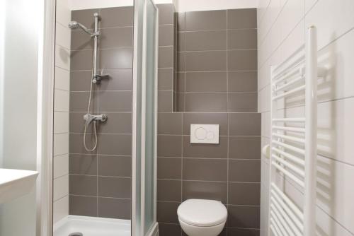 a bathroom with a toilet and a shower at New Pension at ROTOR Brewery in Kunovice