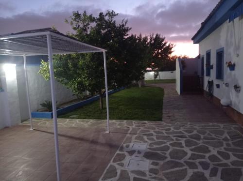 a gazebo on a patio in a yard at MYKONOS entre cepas in Sanlúcar de Barrameda