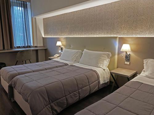 Viva Hotel Avellinoにあるベッド