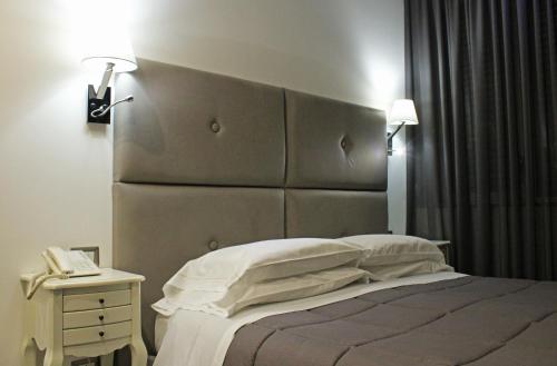 Viva Hotel Avellinoにあるベッド