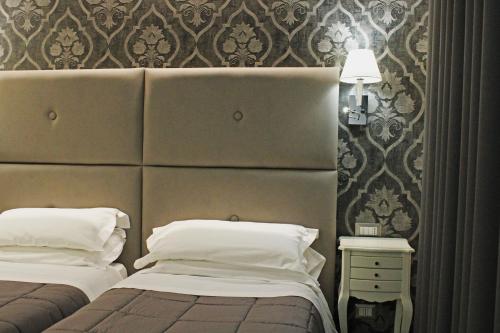 Viva Hotel Avellinoにあるベッド