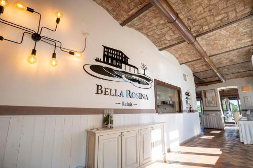 a restaurant with a sign for a boat on the wall at Relais Bella Rosina Pool & Spa in Fiano