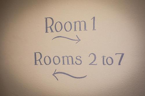 a sign with the words room rooms at Hope and Anchor in Flookburgh