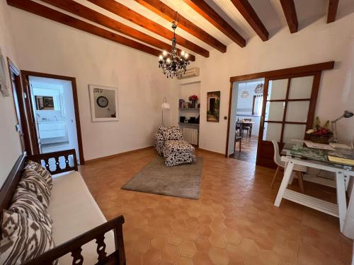 a living room with a couch and a table at Cal Tio Lluc in Sóller