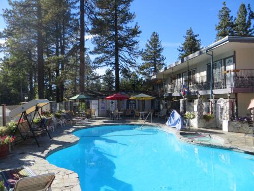 a large swimming pool in front of a building at Americana Village in South Lake Tahoe